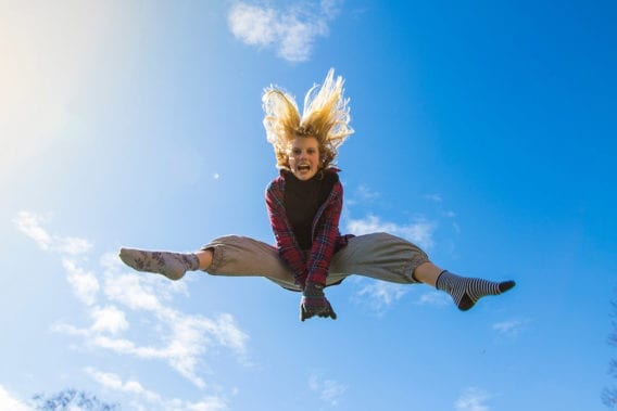 Woman jumping up with energy