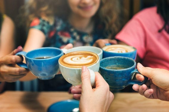 women in cafe with coffee