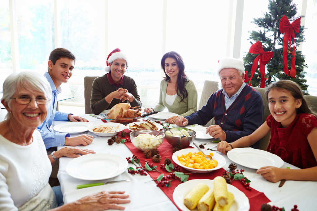 Family enjoying Christmas at dinner table